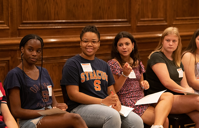 Student volunteers answer questions from new students.